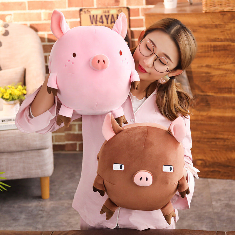 Piggy hands cover the mascot of the year of the pig