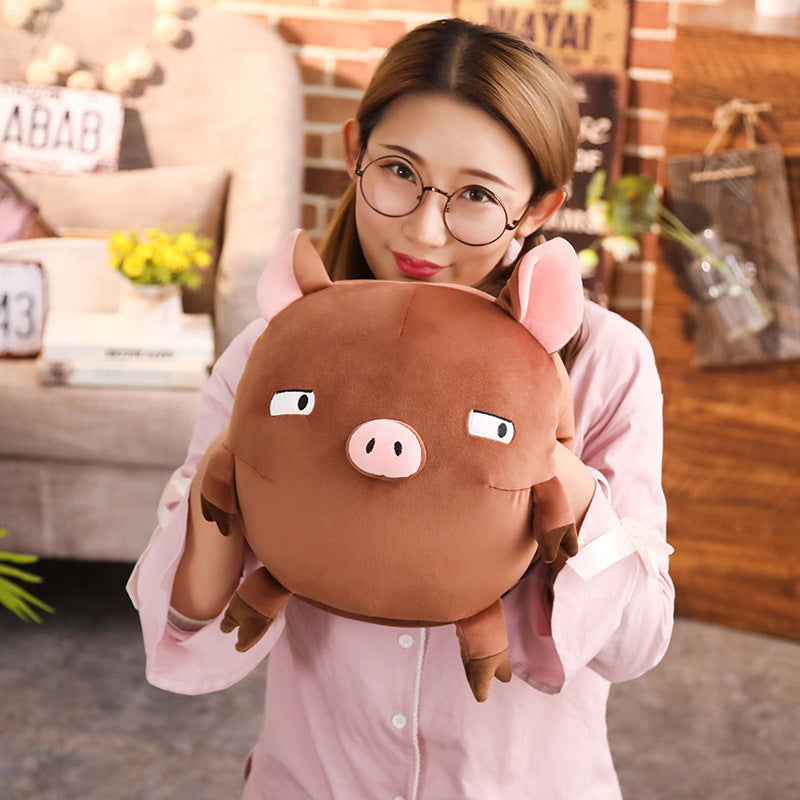 Piggy hands cover the mascot of the year of the pig