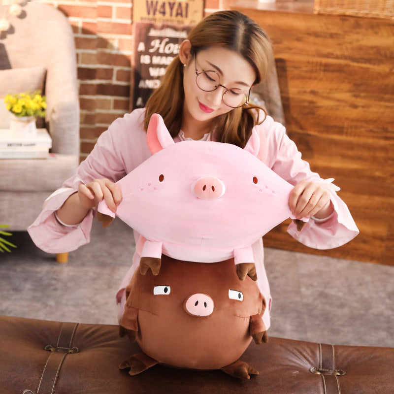 Piggy hands cover the mascot of the year of the pig