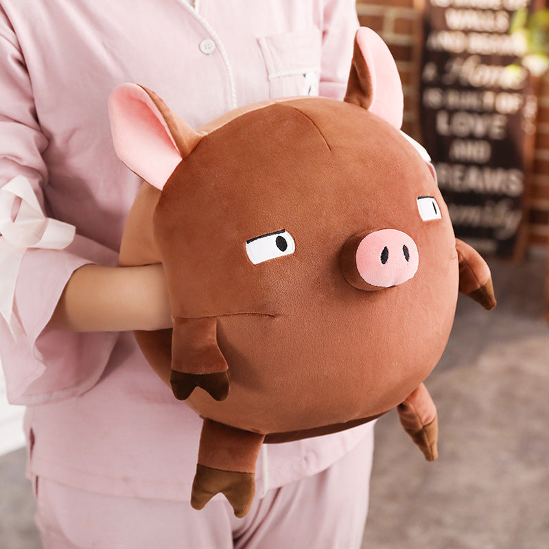 Piggy hands cover the mascot of the year of the pig