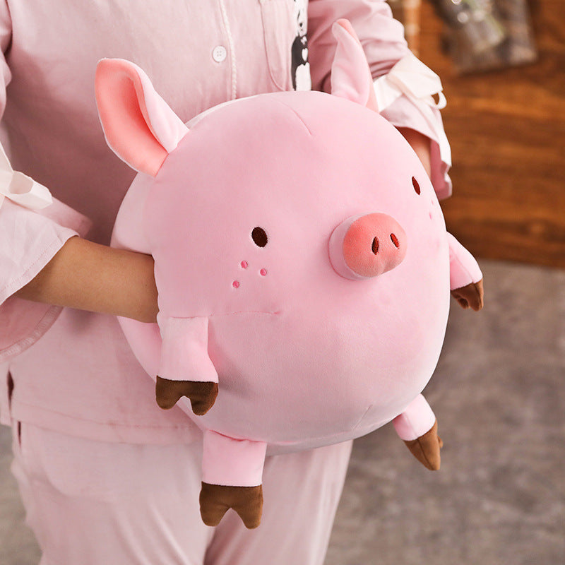 Piggy hands cover the mascot of the year of the pig